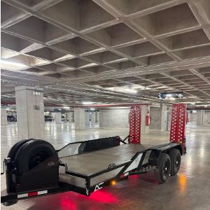 Custom tandem axle equipment trailer with pink LED lighting and black powder coat finish - AC Solutions El Paso custom fabrication
